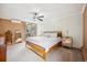 Relaxing main bedroom with a queen-size bed, carpet, accent wall, and views overlooking the city at 955 Eudora St # 307E, Denver, CO 80220