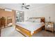 Spacious main bedroom showcasing a queen-sized bed, large window, en suite and stylish accents for a comfortable retreat at 955 Eudora St # 307E, Denver, CO 80220