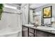 Elegant bathroom with double sinks, granite countertops, and a tiled shower at 8065 E 21St Ave, Denver, CO 80238
