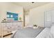 Serene bedroom featuring a dresser with a matching mirror, neutral tones, and soft textures for a peaceful retreat at 8065 E 21St Ave, Denver, CO 80238