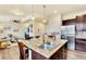 Stylish kitchen island with granite countertops, pendant lighting, and seating for casual dining at 8065 E 21St Ave, Denver, CO 80238