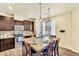 Bright kitchen island with pendant lighting and seating, complemented by stainless steel appliances at 8065 E 21St Ave, Denver, CO 80238
