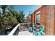 Brick balcony with greenery and chairs, a private spot for outdoor relaxation at 126 S Clarkson St, Denver, CO 80209