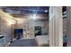 Spacious basement with exposed brick, ductwork, and a large TV for entertainment at 126 S Clarkson St, Denver, CO 80209