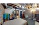 Spacious basement with exposed brick, ductwork, and ample room to add furnishings at 126 S Clarkson St, Denver, CO 80209