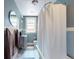 Cozy bathroom with vintage tub, updated fixtures, and a marble tile floor at 126 S Clarkson St, Denver, CO 80209
