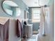 Cozy bathroom with vintage tub, updated fixtures, and a marble tile floor at 126 S Clarkson St, Denver, CO 80209