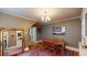 Charming dining room with wood floors, a chandelier and a vintage rug at 126 S Clarkson St, Denver, CO 80209