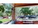 Welcoming front porch with brick pillars offering a charming view of the tree-lined street at 126 S Clarkson St, Denver, CO 80209