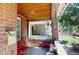 Charming front porch features a cozy seating area perfect for enjoying the outdoors at 126 S Clarkson St, Denver, CO 80209