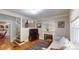 Cozy living room with hardwood floors, fireplace, and staircase at 126 S Clarkson St, Denver, CO 80209