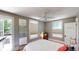 Comfortable main bedroom with ceiling fan, and light-filled balcony access at 126 S Clarkson St, Denver, CO 80209