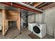 Basement utility area featuring a furnace, new washer and dryer, and exposed ductwork at 1419 Red Mountain Dr # 126, Longmont, CO 80504