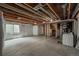 Large unfinished basement, concrete floor, utility connections, and natural light at 1419 Red Mountain Dr # 126, Longmont, CO 80504