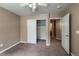 Bedroom features neutral walls, carpet flooring, a closet, and access to the bathroom at 1419 Red Mountain Dr # 126, Longmont, CO 80504