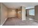 Inviting dining area open to the kitchen with carpeted floor, lots of light, and a chandelier at 1419 Red Mountain Dr # 126, Longmont, CO 80504