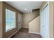 Inviting entryway features a window, coat closet, neutral walls, and view of the staircase at 1419 Red Mountain Dr # 126, Longmont, CO 80504