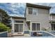 A view of back of the house with siding, small patio, and a satellite dish at 1419 Red Mountain Dr # 126, Longmont, CO 80504