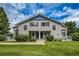 Two-story townhome with gray siding, blue trim, and well-maintained lawn and blue doors at 1419 Red Mountain Dr # 126, Longmont, CO 80504