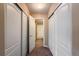 Hallway view with closet and bathroom access, shows lots of accessible storage and bright lighting at 1419 Red Mountain Dr # 126, Longmont, CO 80504