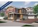 Inviting two-story home with a two-car garage and charming front porch under construction at 1181 Highview Dr, Erie, CO 80516