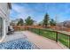 View of the deck with blue outdoor rug, a fenced yard and view of neighborhood at 600 Balsa Dr, Castle Rock, CO 80104