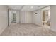 Finished basement with carpet and doorway to bathroom at 600 Balsa Dr, Castle Rock, CO 80104