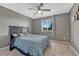 Carpeted bedroom with neutral paint and a large window with blinds and curtains at 600 Balsa Dr, Castle Rock, CO 80104
