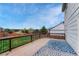 View from the deck with wooden railings and a blue patterned rug on a sunny day at 600 Balsa Dr, Castle Rock, CO 80104