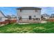 View of back of home, fenced yard, and outdoor deck, great for entertaining at 600 Balsa Dr, Castle Rock, CO 80104