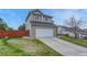Charming two-story home featuring a spacious driveway and attached garage, offering both convenience and curb appeal at 600 Balsa Dr, Castle Rock, CO 80104