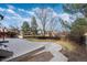A backyard with a concrete patio, well maintained lawn, and a privacy fence at 7636 S Allison Ct, Littleton, CO 80128