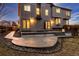 Spacious backyard featuring a large concrete patio and a well-maintained lawn at 7636 S Allison Ct, Littleton, CO 80128