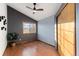 Bright bedroom featuring wood floors, a vaulted ceiling with fan, and a window with views at 7636 S Allison Ct, Littleton, CO 80128
