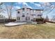 The exterior backyard features a patio, grass, and beautiful landscaping at 7636 S Allison Ct, Littleton, CO 80128