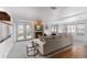 Bright living room with cozy fireplace, neutral walls, and access to the backyard through French doors at 7636 S Allison Ct, Littleton, CO 80128