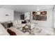 Open concept living area with views into the kitchen, stairs, and access to the backyard at 7636 S Allison Ct, Littleton, CO 80128