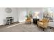 Cozy sitting area showcasing neutral walls and carpet, with comfortable chairs and natural light at 7636 S Allison Ct, Littleton, CO 80128