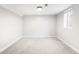 Finished basement with carpeting, base trim, and a window for natural light at 4300 Osage St, Denver, CO 80211
