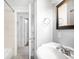Neutral bathroom featuring a white vanity, chrome fixtures, and tile flooring at 4300 Osage St, Denver, CO 80211