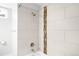 Updated bathroom featuring modern shower with decorative tiles at 4300 Osage St, Denver, CO 80211