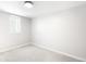 A bright bedroom with neutral carpet, fresh paint, and a window at 4300 Osage St, Denver, CO 80211