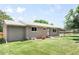 Ranch-style house with a well-maintained lawn, and a driveway leading to the attached garage at 4300 Osage St, Denver, CO 80211