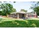 Charming one-story home with a well-maintained lawn and covered patio offers comfortable outdoor living at 4300 Osage St, Denver, CO 80211