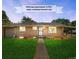 Charming single-story home featuring a lush green lawn, inviting walkway, and seller assisted interest rate at 4300 Osage St, Denver, CO 80211