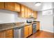 Updated kitchen with stainless steel appliances, granite countertops, and wooden cabinets at 4300 Osage St, Denver, CO 80211