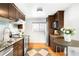 Bright kitchen with stainless steel appliances, granite countertops, and eat-in dining area at 4300 Osage St, Denver, CO 80211