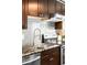 Modern kitchen with stainless steel appliances, granite countertops, and stylish backsplash at 4300 Osage St, Denver, CO 80211