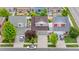 An elevated shot shows the house, its driveway, and surrounding neighborhood landscaping at 5536 Kirk St, Denver, CO 80249