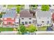 Aerial view showcases the property's backyard, including a deck and play area at 5536 Kirk St, Denver, CO 80249